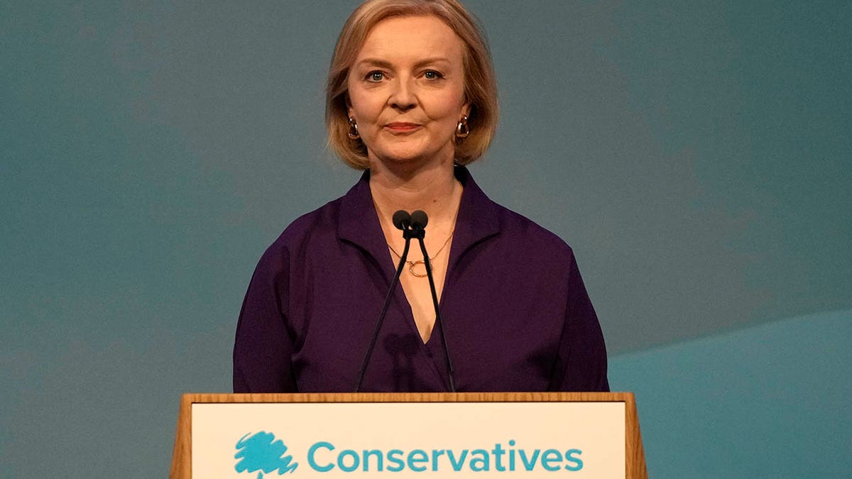 Liz Truss at a podium