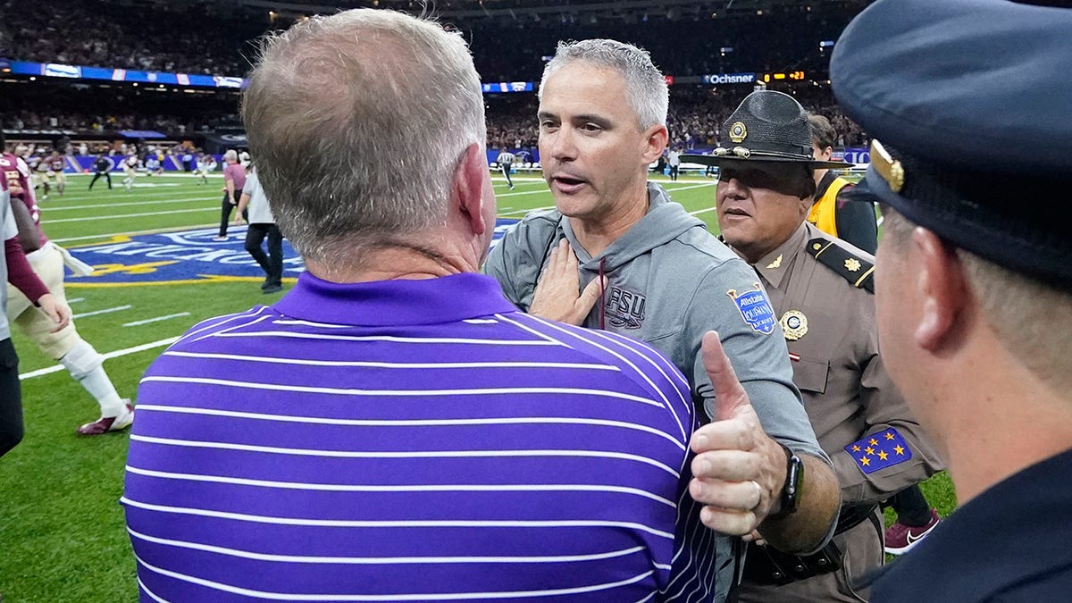 Brian Kelly and Mike Norvell shake hands