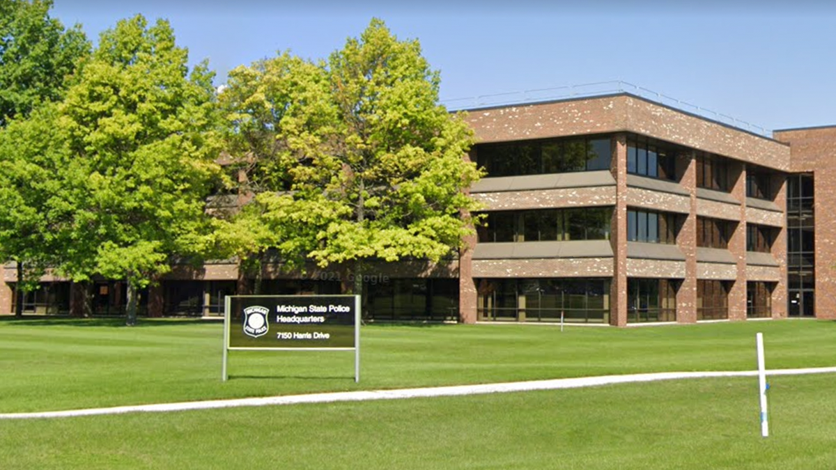 Photo shows exterior and sign for the Michigan State Headquarters