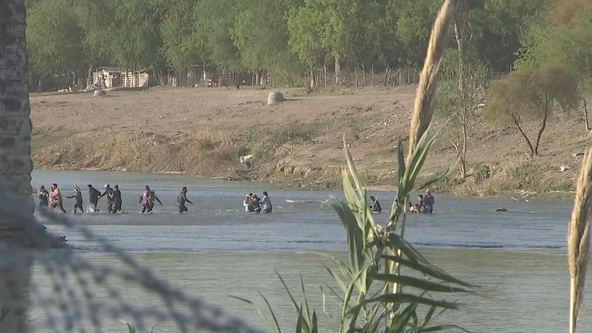 Migrants crossing the Rio Grande