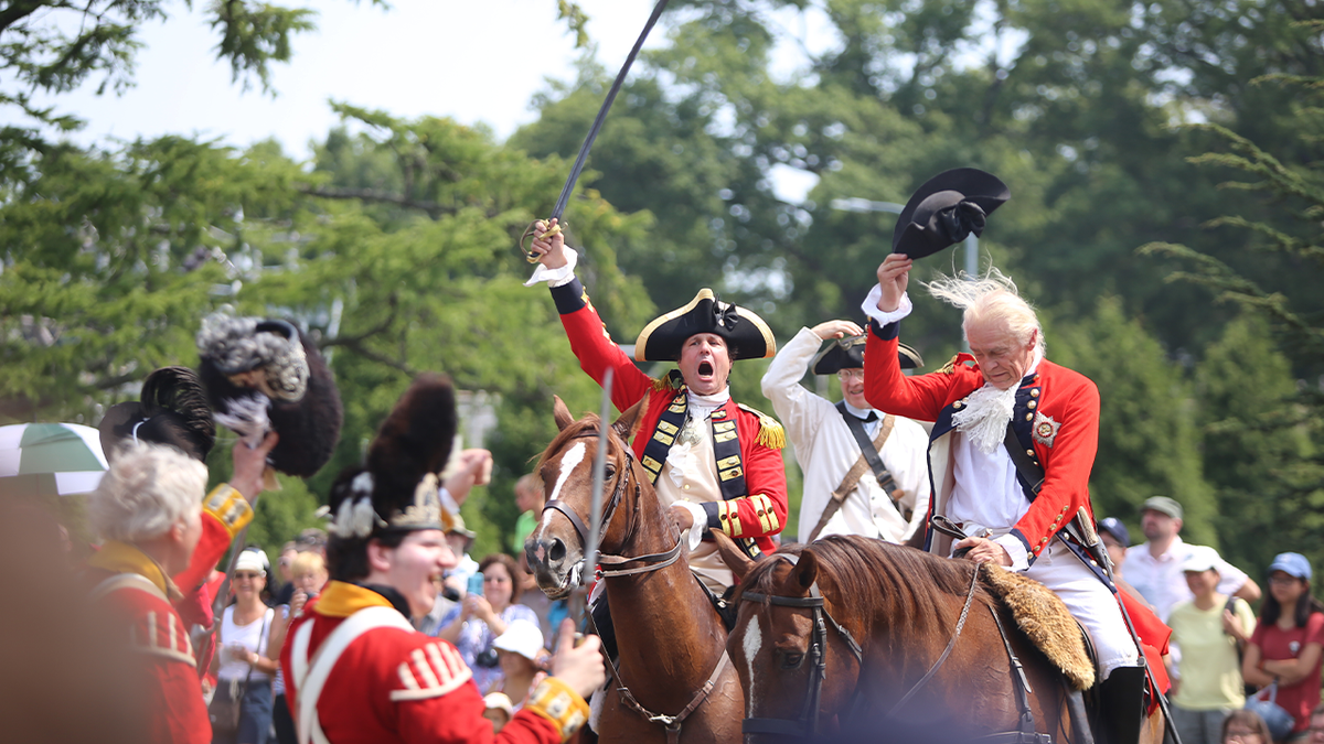 Men dressed as British soldiers during Revolutionary War seen participating in reenactment in NYC