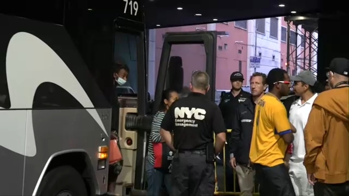 A bus full of migrants arrives in NYC
