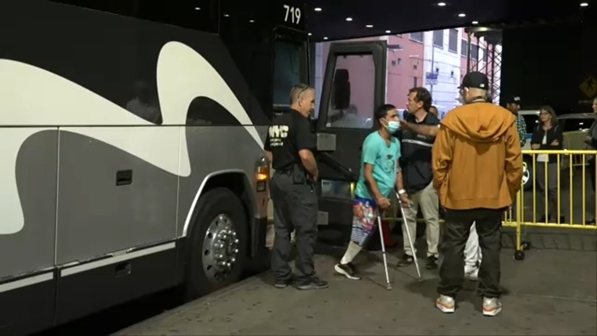 nyc migrant on crutches