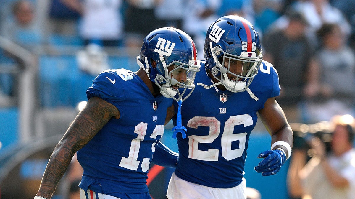 Odell Beckham and Saquon Barkley walking together