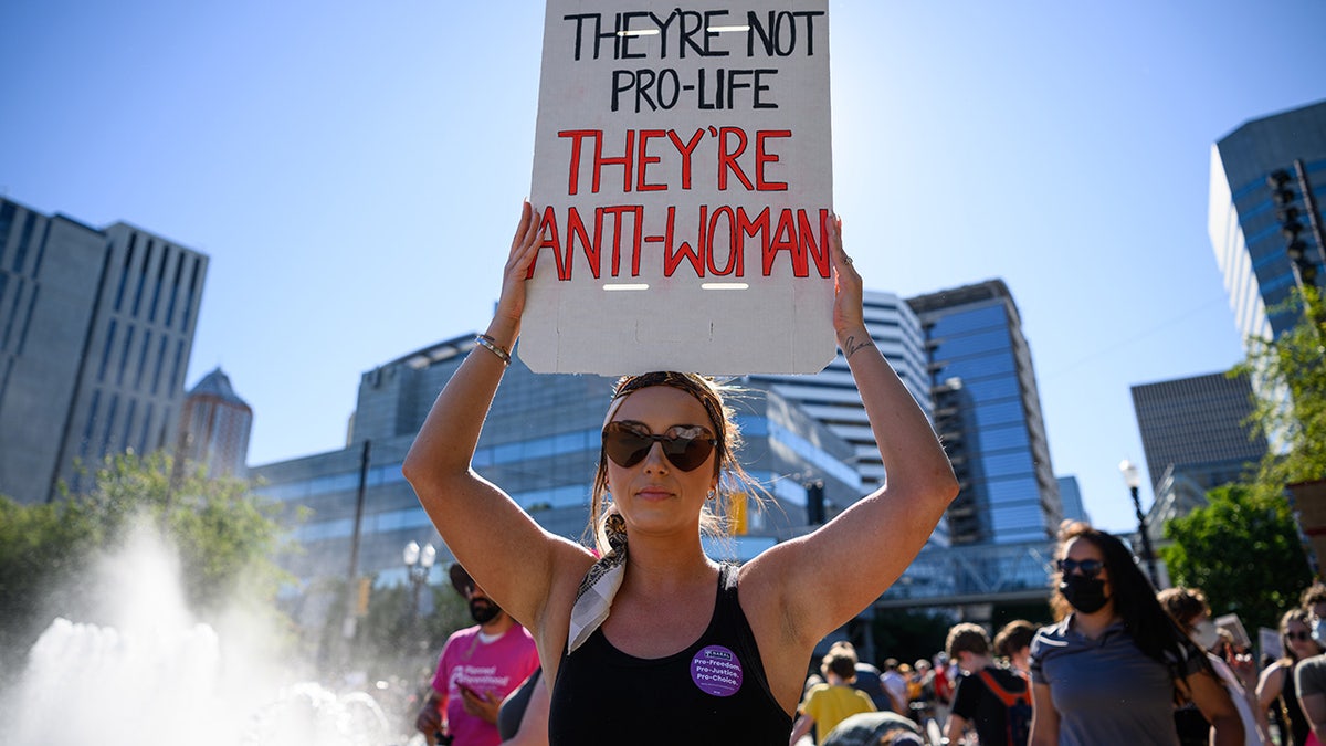 Abortion rights protesters hold signs in Portland, Oregon