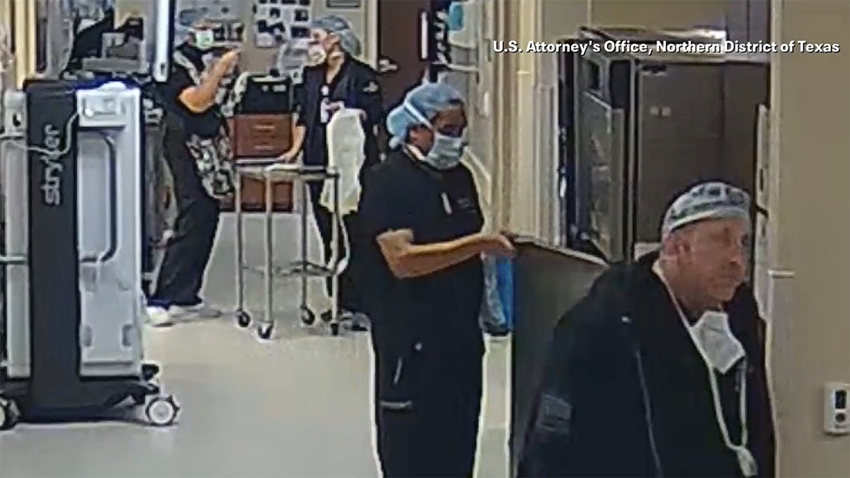 Dr. Ortiz on surveillance video placing IV bag