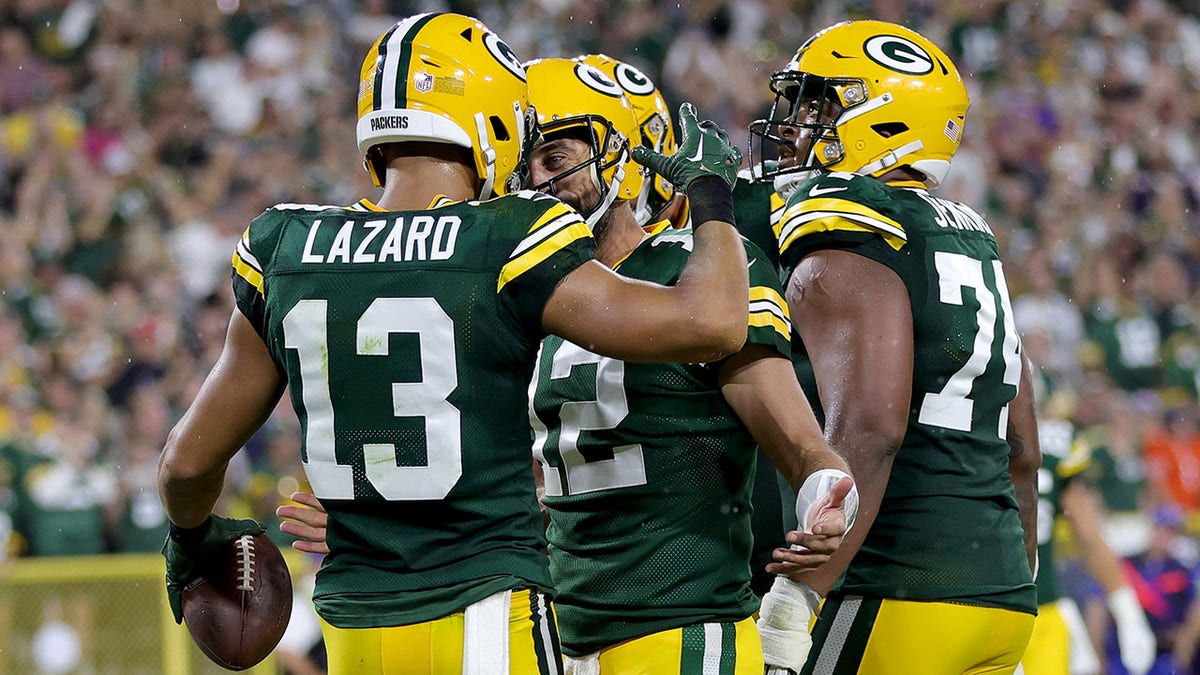 Allen Lazard celebrating a touchdown with teammates