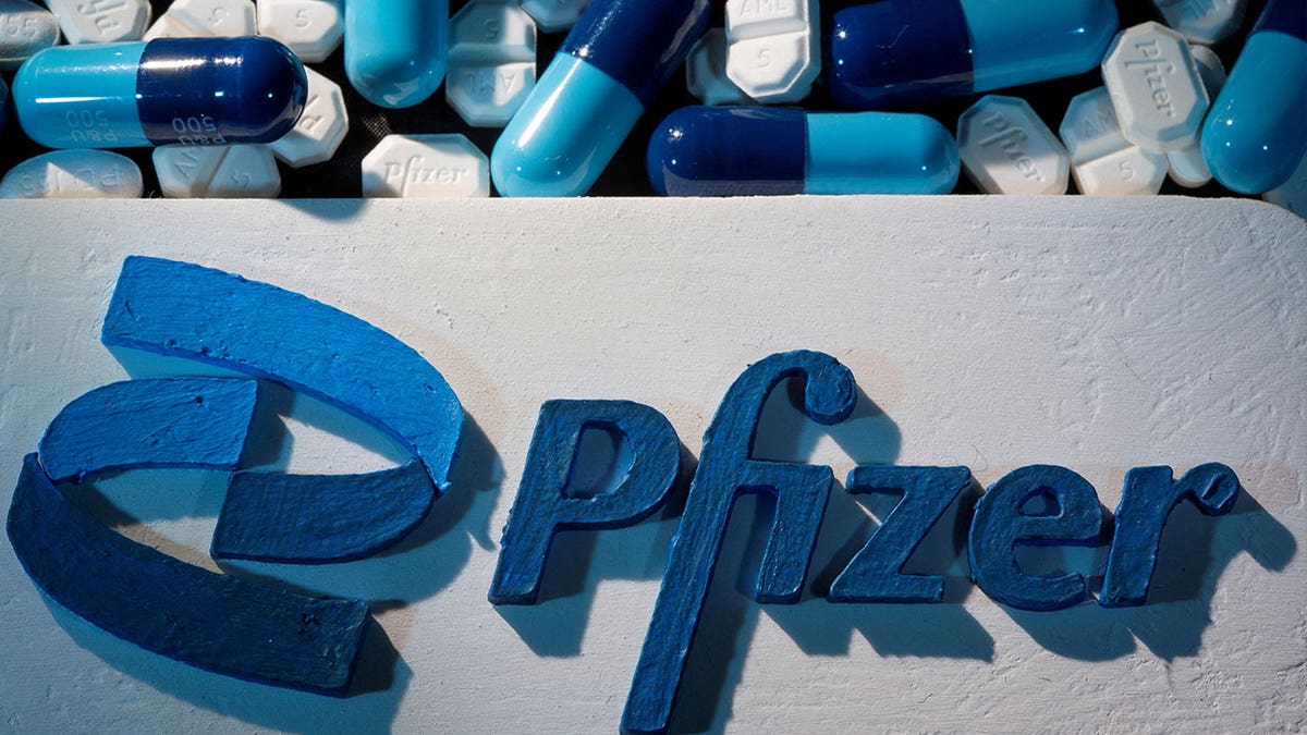 Pfizer logo and pills