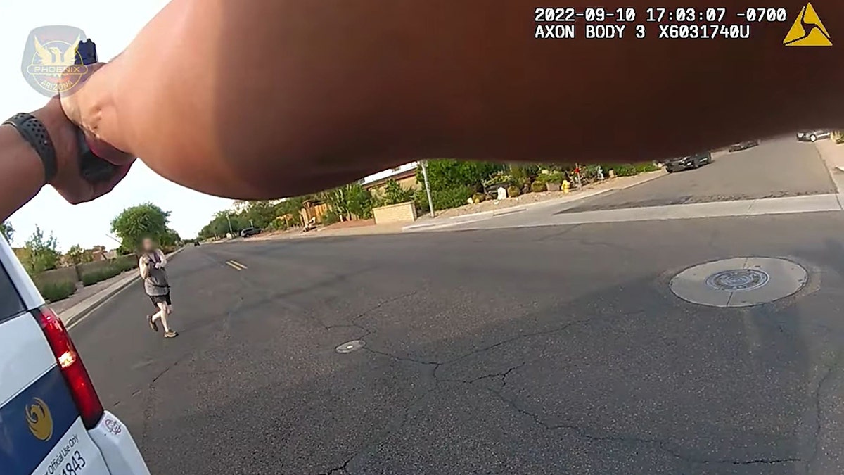 suspect approaches officers with sword raised