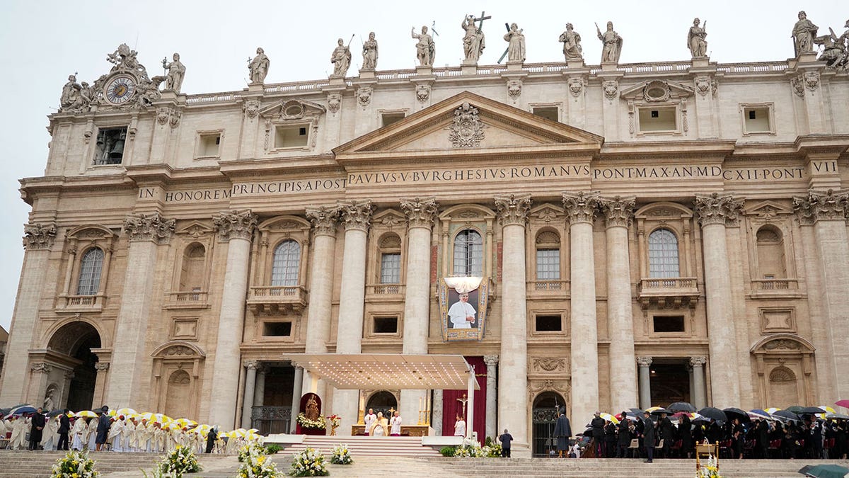 The Vatican puts up a sign with Pope John Paul I during daytime