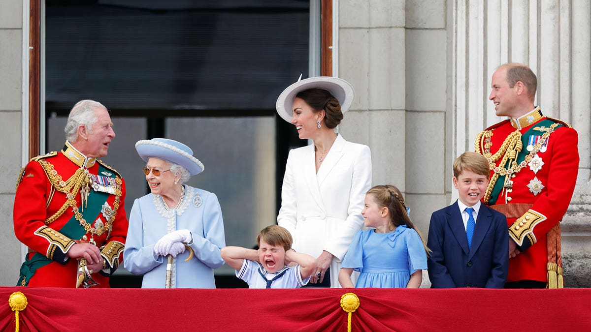 King Charles, Prince William, Queen Elizabeth II, Prince Louis, Princess Catherine, Princess Charlotte, Prince George and Prince William watching a flypast from the balcony of Buckingham Palace 