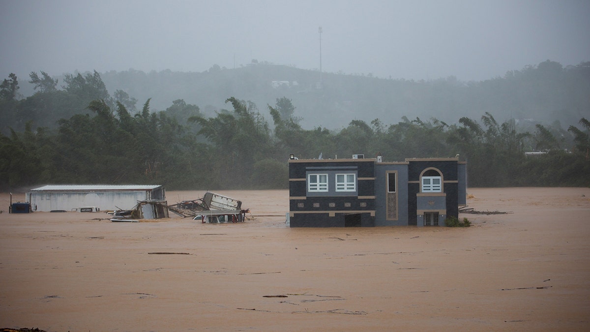 flood waters submerging home