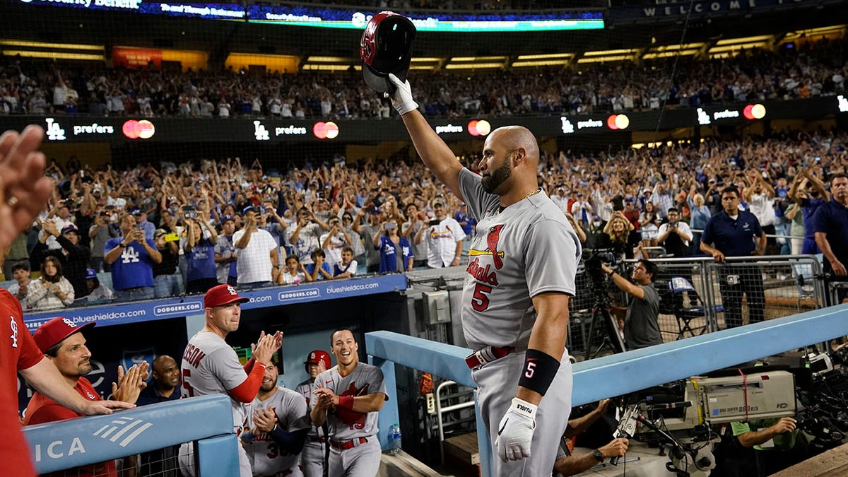 Albert Pujols salutes after 700