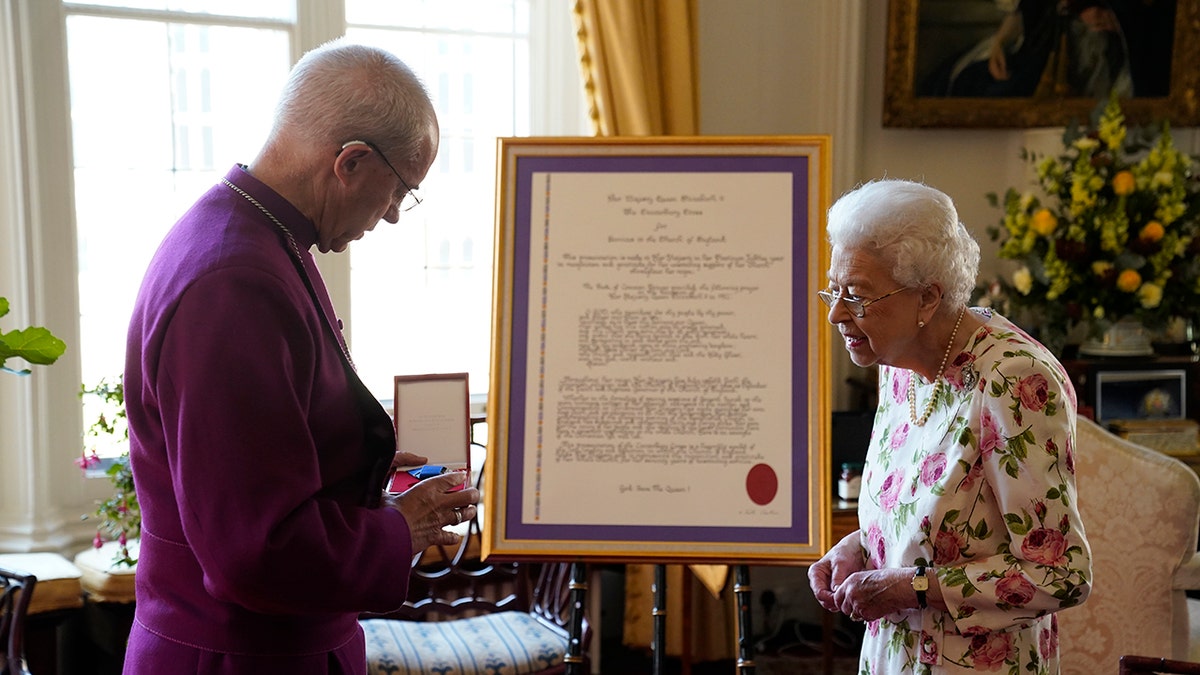 The Archbishop of Canterbury speaks to Queen Elizabeth II