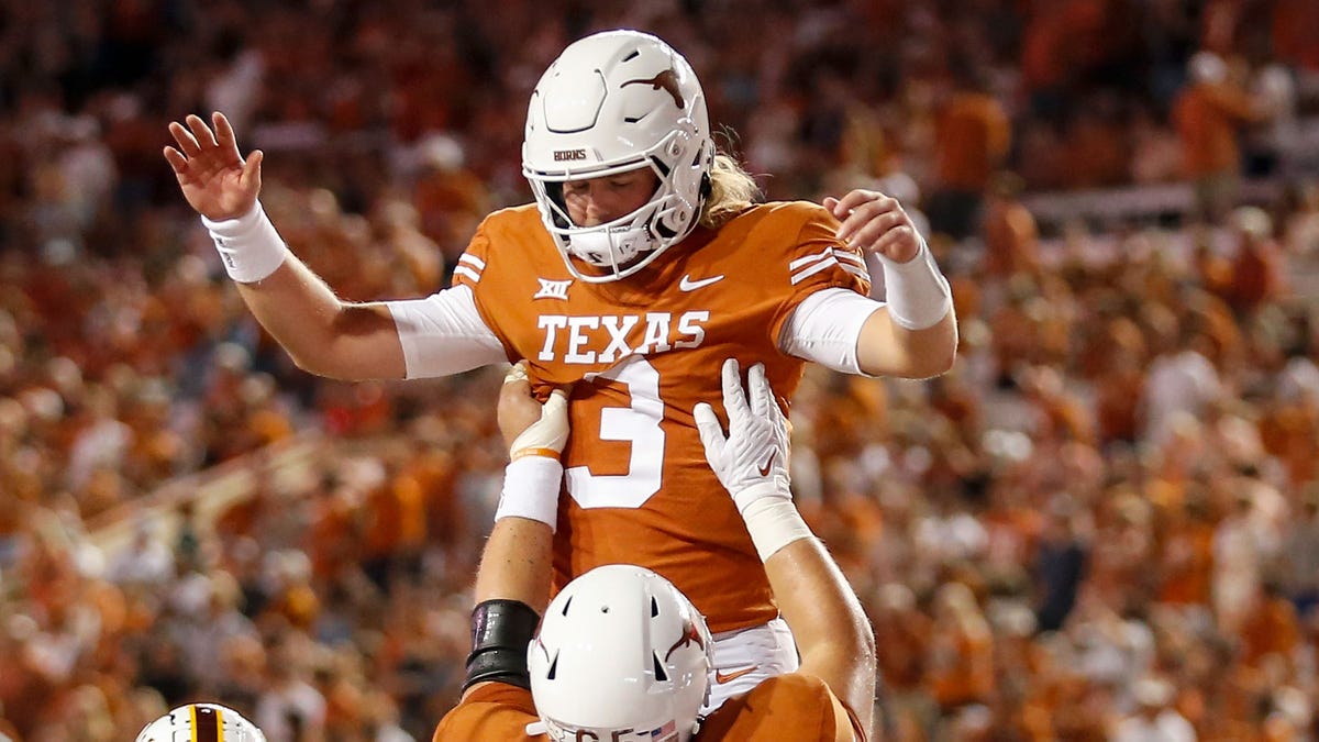 Quinn Ewers celebrates touchdown