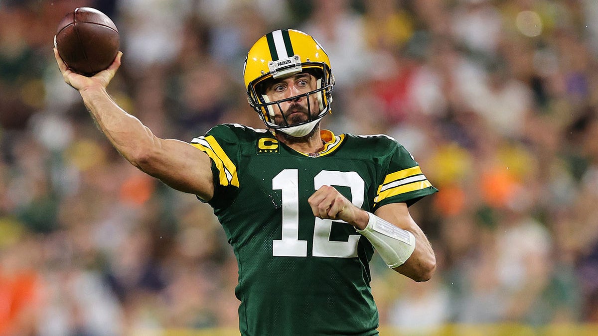 Aaron Rodgers throwing the football