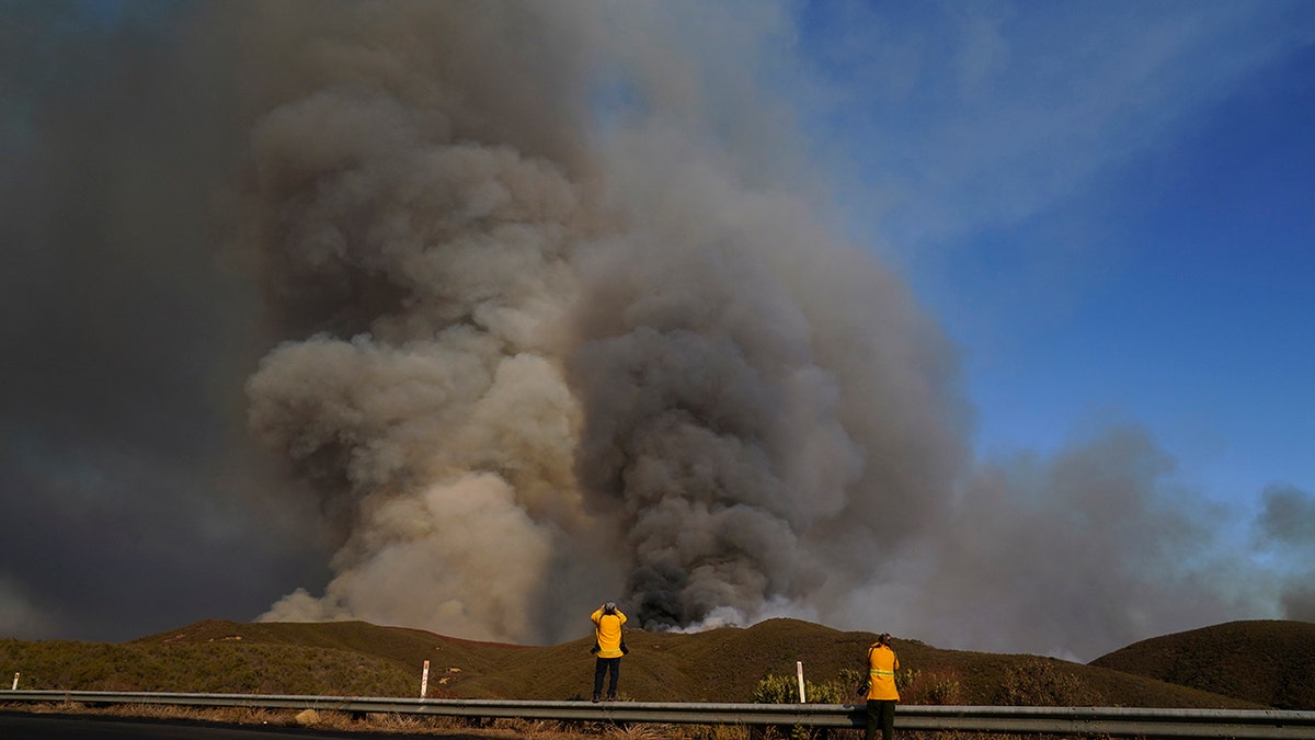 A cloud of smoke is seen over the Route Fire
