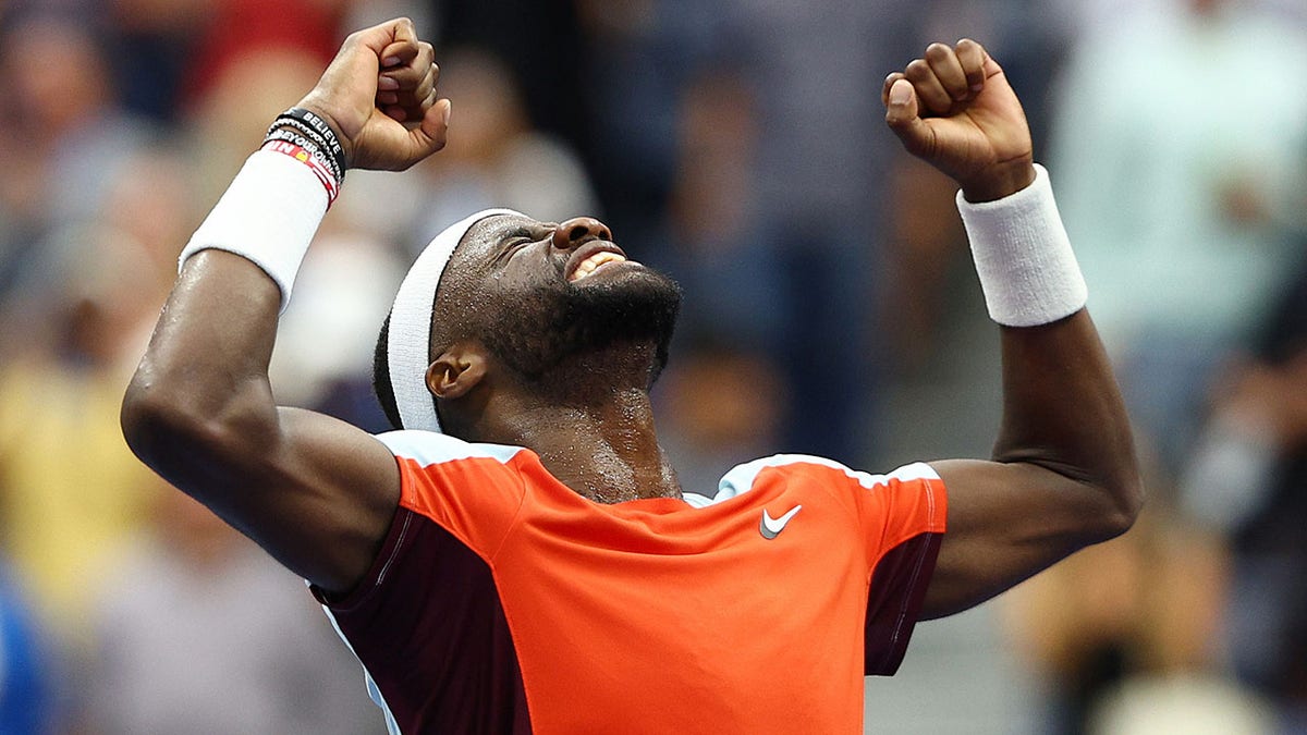 Frances Tiafoe celebrates