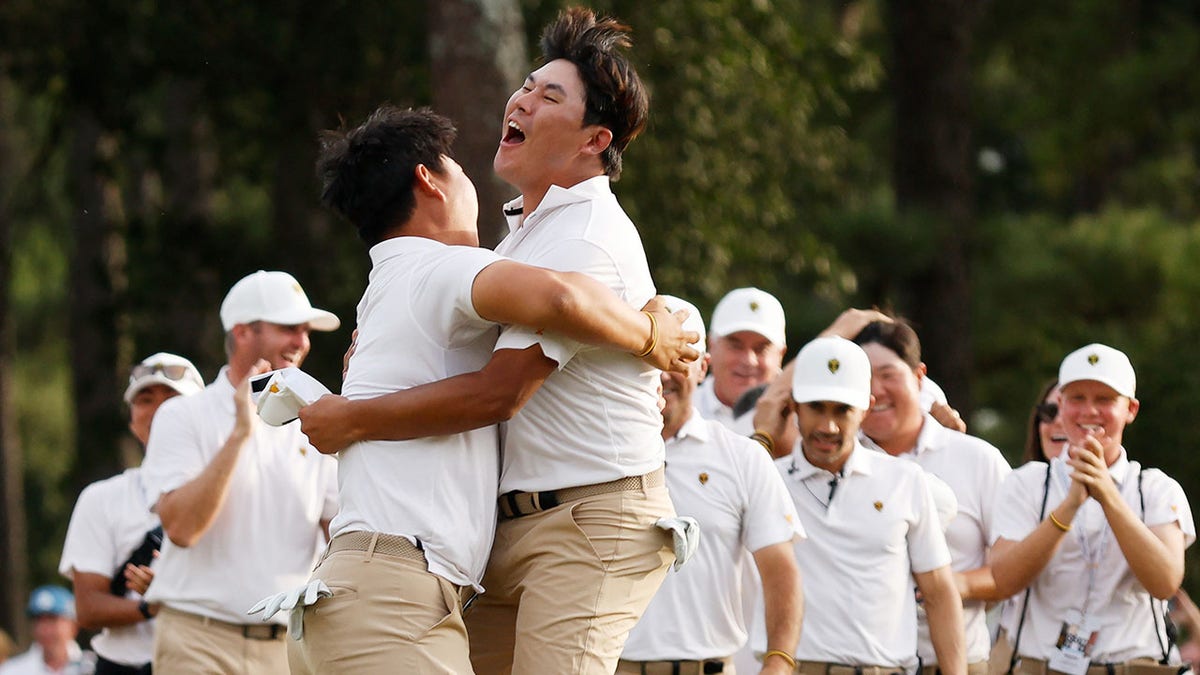 Tom and Si Woo Kim hug