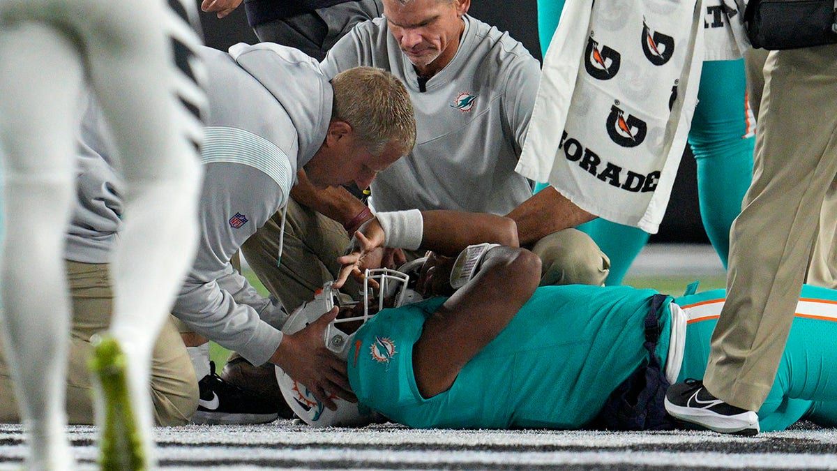 Miami Dolphins quarterback Tua Tagovailoa on turf