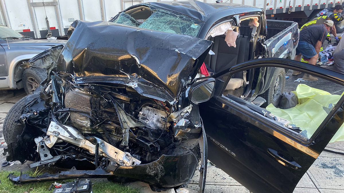 A wrecked car after the driver and passenger, an illegal migrant, were killed