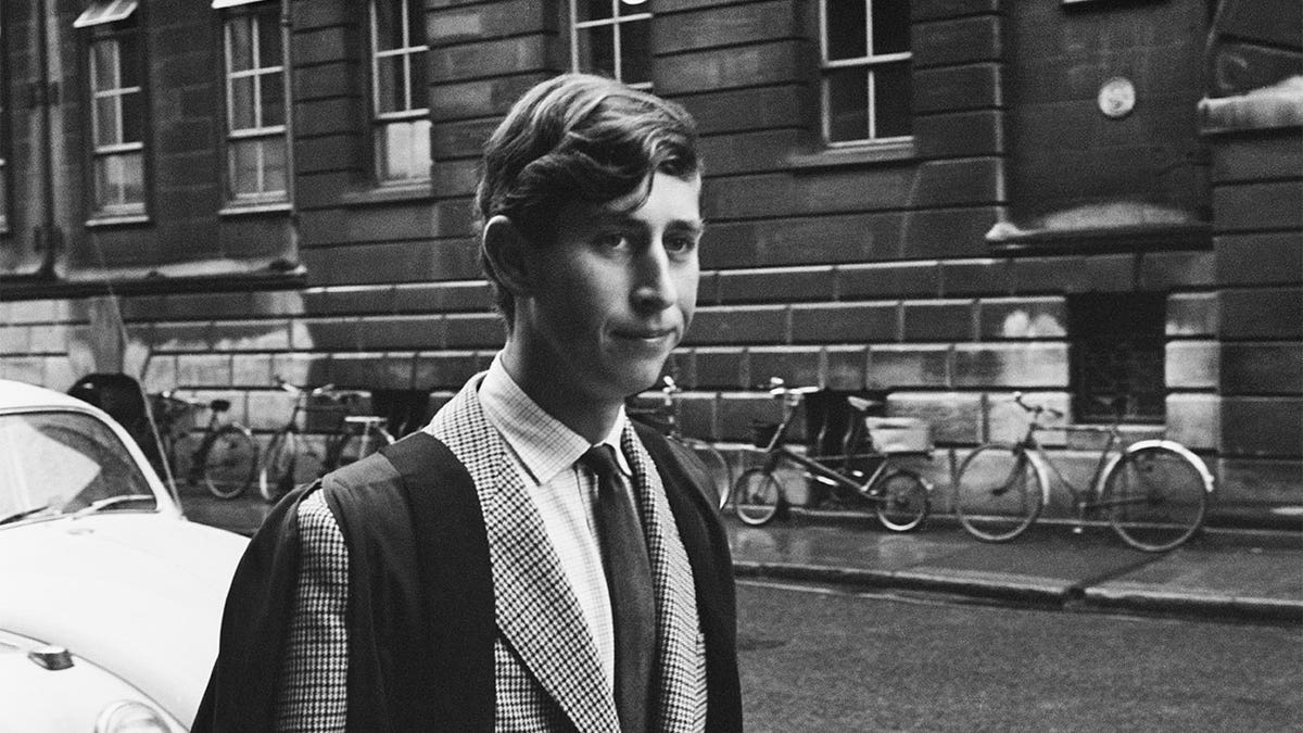 A young Prince Charles walking in Downing Street, Cambridge, U