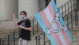 Trans protester at Ohio Statehouse in 2021.