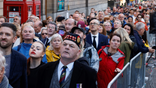 Members of the public queue