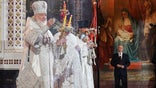 FILE - In this photo released by Russian Orthodox Church Press Service, Russian Orthodox Church Patriarch Kirill, left, conducts the Easter service accompanied by President Vladimir Putin, background right, at the Christ the Savior Cathedral in Moscow, Russia, early Sunday, April 24, 2022. Russian soldiers who die in the line of duty in Ukraine have all of their sins forgiven, the patriarch of the Russian Orthodox Church proclaimed in a sermon on Sunday, Sept. 25, 2022, comparing their sacrificial death to that of Jesus. (Oleg Varov/Russian Orthodox Church Press Service via AP)
