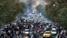 Iran protests: 9 dead in escalating unrest as demonstrators set fire to police stations, stab regime enforcer