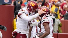 Commanders' Carson Wentz throws 4 touchdowns in team debut to beat Jaguars