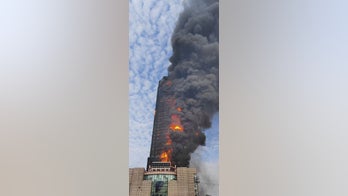 42-floor Chinese skyscraper engulfed in flames
