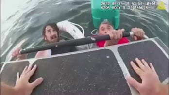 Video shows father, son pulled from Boston Harbor after boat sinks: 'We're so weak'