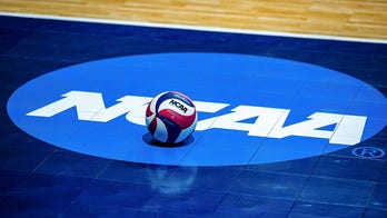 Houston libero Kate Georgiades dives across table to make rally-saving play in NCAA Tournament match