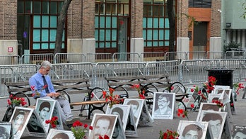 Survivors of Iran 'death commission' decry Raisi at United Nations, fill park with 2,000 photos of victims