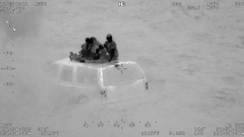 Arizona helicopter crew rescues family of 6 stranded on roof of vehicle during flood