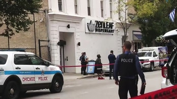 Ax-wielding suspect fatally shot by Chicago dispensary guard after attack: police