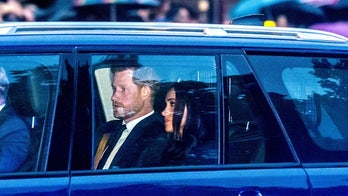 Prince Harry and Meghan Markle join royal family at Buckingham Palace to receive Queen Elizabeth II's coffin
