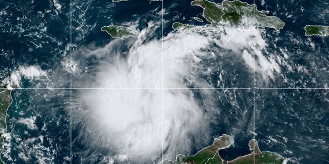 This satellite image provided by the National Oceanic and Atmospheric Administration shows Tropical Storm Ian over the central Caribbean on Saturday, Sept. 24, 2022.  (NOAA via AP)