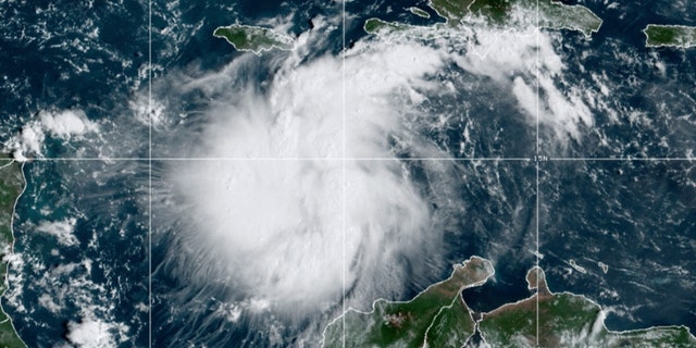 This satellite image provided by the National Oceanic and Atmospheric Administration shows Tropical Storm Ian over the central Caribbean on Saturday, Sept. 24, 2022. (NOAA via AP)