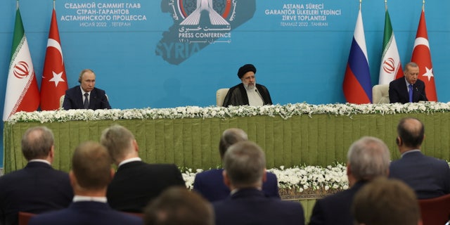 Iranian President Ebrahim Raisi, Russian President Vladimir Putin and Turkish President Recep Tayyip Erdogan attend a news conference after the Astana Process summit on July 19, 2022 in Tehran, Iran. 