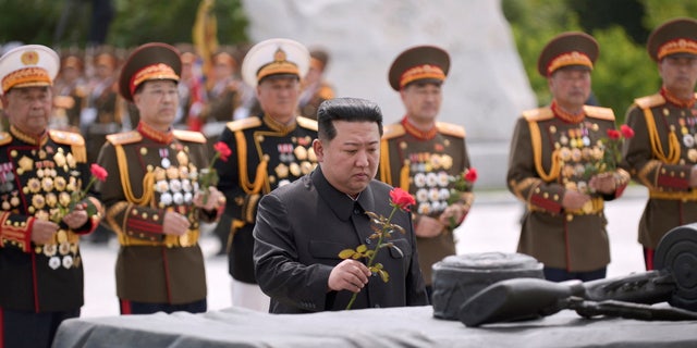 North Korea's leader Kim Jong Un places a flower to pay tribute to the North's soldiers killed in the Korean War and buried at the Fatherland Liberation War Martyrs Cemetery to mark the 69th anniversary of the Korean War armistice in Pyongyang, North Korea, in this photo released July 27, 2022.