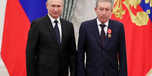 Russian President Vladimir Putin stands next to First Executive Vice President of oil producer Lukoil Ravil Maganov after decorating him with the Order of Alexander Nevsky during an awarding ceremony at the Kremlin in Moscow, Russia, November 21, 2019. 