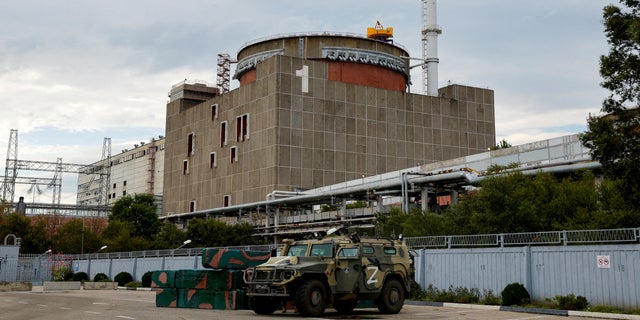 A Russian all-terrain armored vehicle is parked outside the Zaporizhzhia Nuclear Power Plant during the visit of the International Atomic Energy Agency's (IAEA) expert mission.