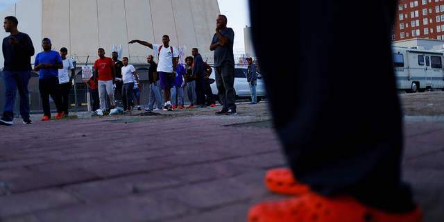 Migrants from Venezuela gather near a bus station after being released from U.S. Border Patrol custody in El Paso, Texas, U.S., September 13, 2022.