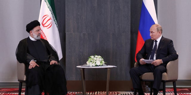 Russian President Vladimir Putin meets with Iranian President Ebrahim Raisi on the sidelines of the Shanghai Cooperation Organization (SCO) summit in Samarkand, Uzbekistan, Sept. 15, 2022. Iran's Presidential Website/WANA (West Asia News Agency)/Handout via Reuters)