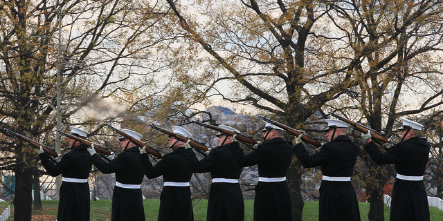  A U.S. Marine firing party fires a 21-gun salute during a funeral service for U.S. Marine Staff Sgt. Javier Ortiz Rivera at Arlington National Cemetery Dec. 2, 2010 in Arlington, Virginia. Rivera, from Rochester, New York, was reportedly killed Nov. 16, 2010 during combat operations in Afghanistan. 