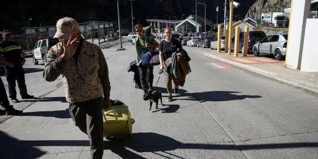 Travelers from Russia cross the border to Georgia at the Zemo Larsi/Verkhny Lars station, Georgia September 26, 2022. 