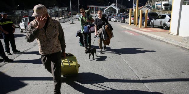 Travelers from Russia cross the border to Georgia at the Zemo Larsi/Verkhny Lars station, Georgia September 26, 2022.