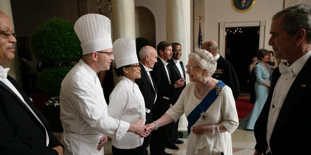 Queen Elizabeth offers her sincere thanks to members of the Executive Residence Staff of the White House who helped put together the State Dinner in her honor. (Photo as it appears in 